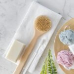 Flat lay of travel towels with bathroom accessories