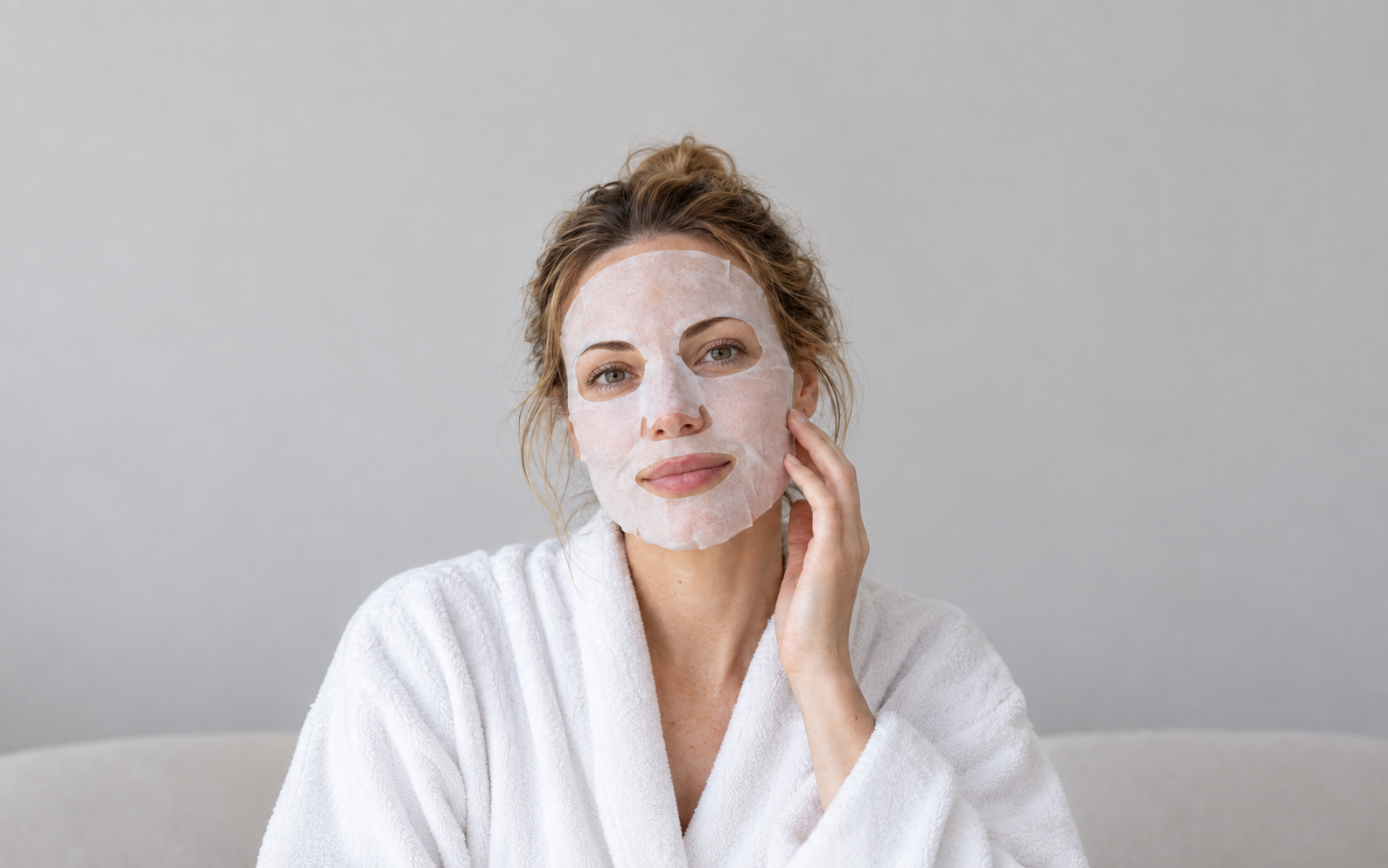 Woman wearing a white nonwoven sheet face mask